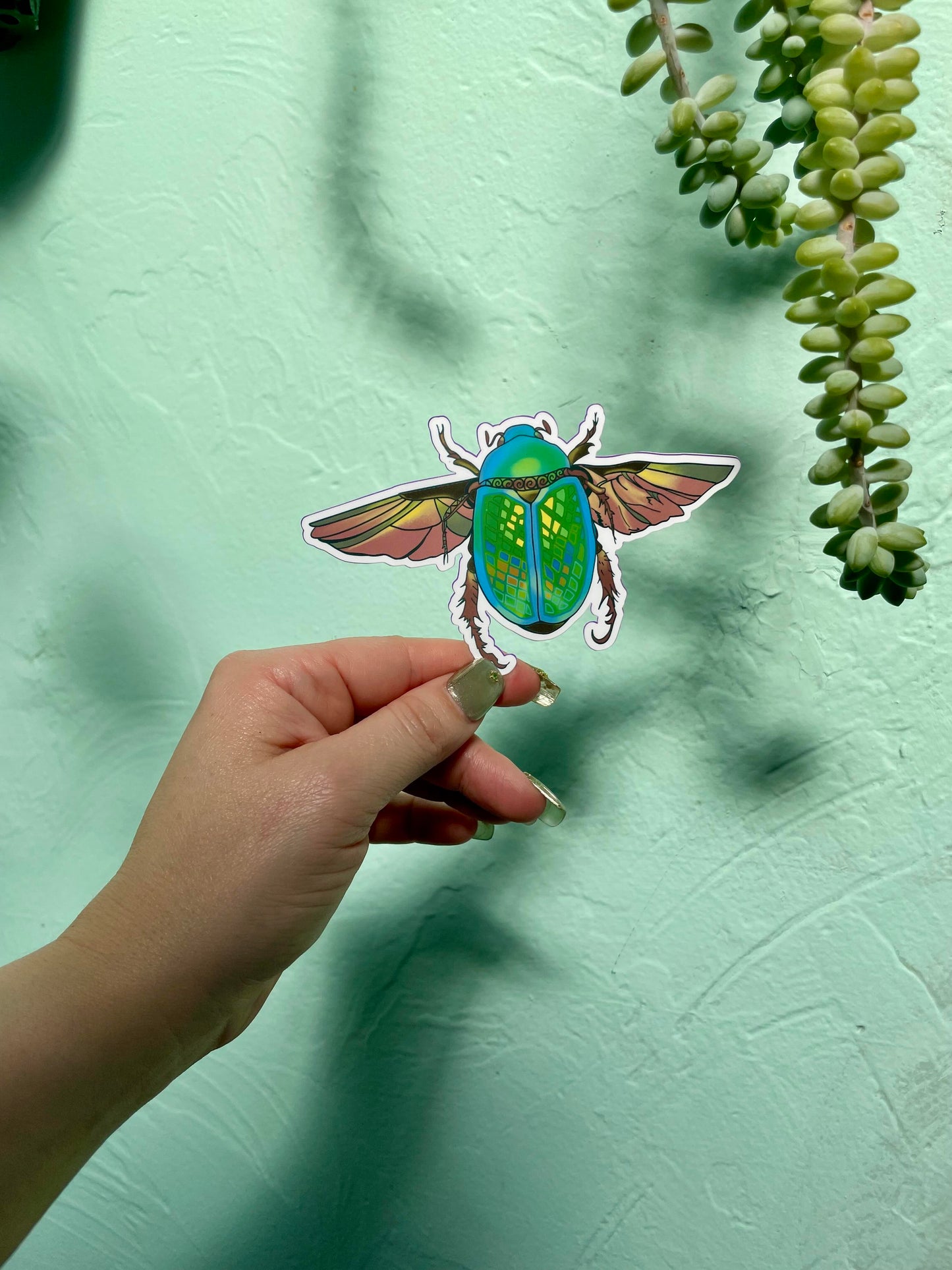 Green Scarob Beetle In Flight Glossy Water resistant Vinyl Sticker